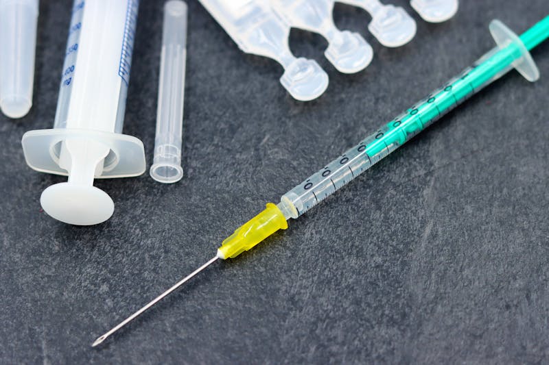 Insulin syringe and medical supplies closeup