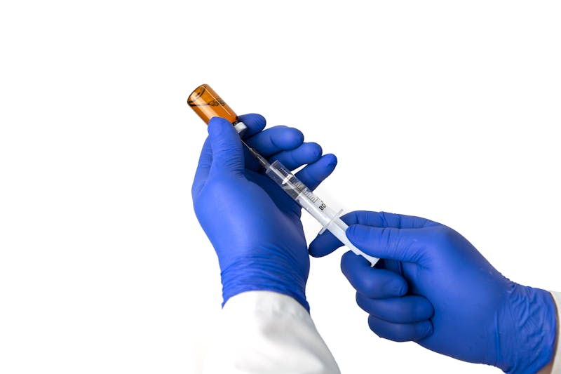 peptide reconstitution calculator - drawing solution from vial with insulin syringe
